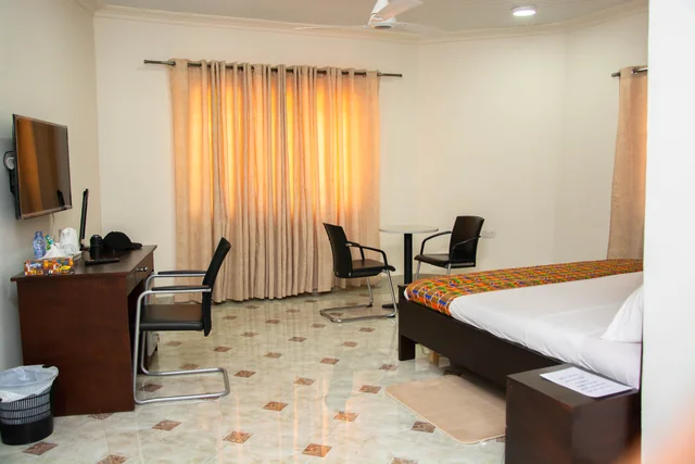 Guest room with bed and seating
